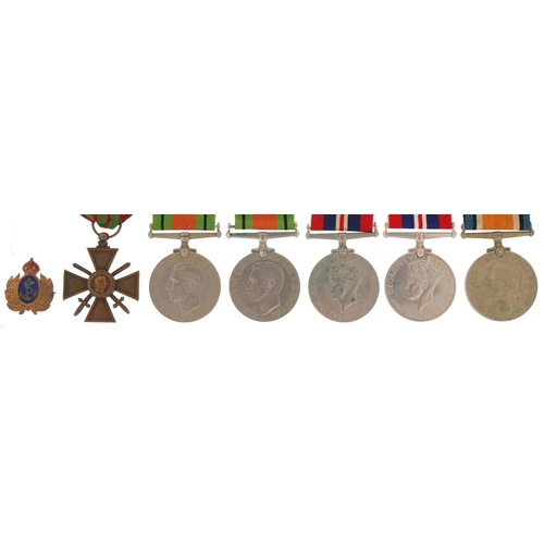 2522 - Militaria including five British military World War II medals with ribbons and a naval interest enam... 