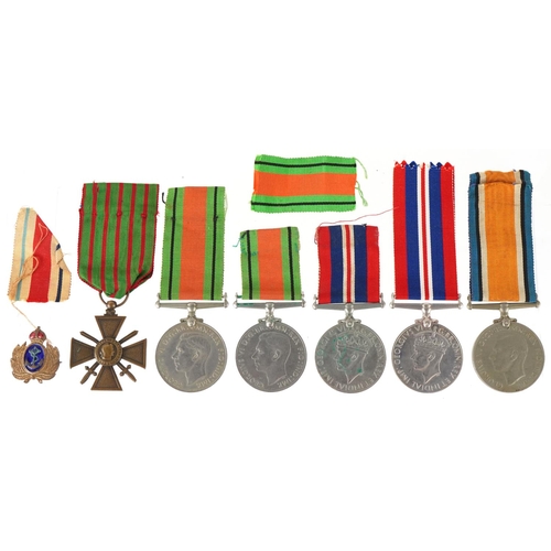 2522 - Militaria including five British military World War II medals with ribbons and a naval interest enam... 