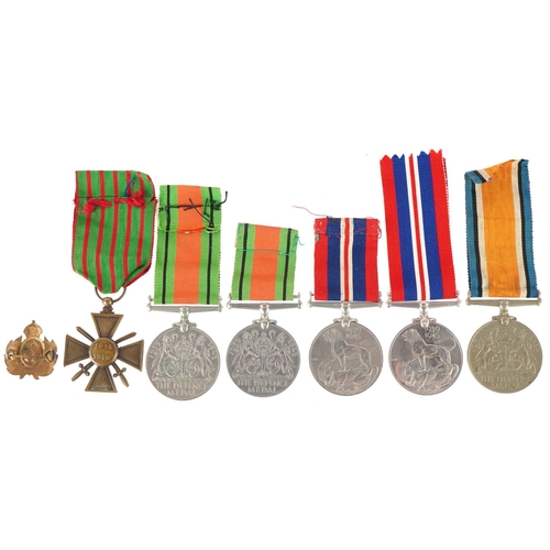 2522 - Militaria including five British military World War II medals with ribbons and a naval interest enam... 