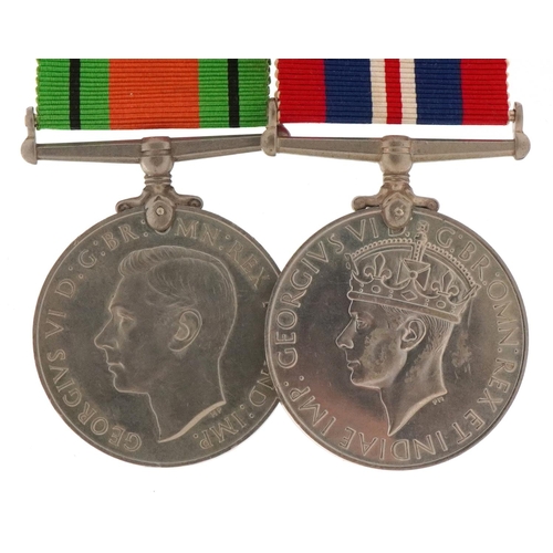 2523 - British military World War II medal pair with bar and box of issue to J A McMasters, Esq