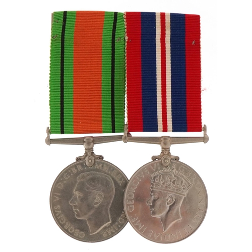 2523 - British military World War II medal pair with bar and box of issue to J A McMasters, Esq