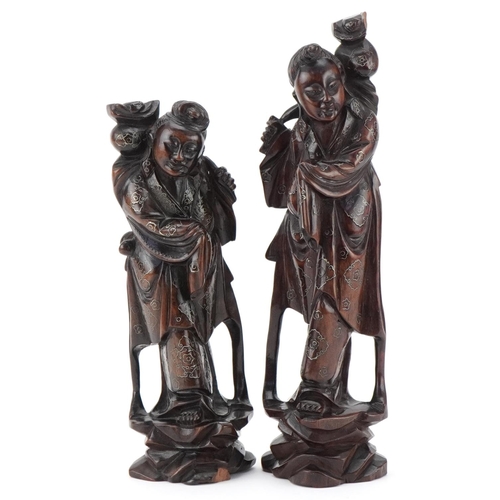 152 - Two Chinese carved softwood figures of elders, 20th century, with wire inlaid decoration, the larges... 