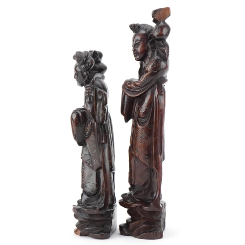 152 - Two Chinese carved softwood figures of elders, 20th century, with wire inlaid decoration, the larges... 