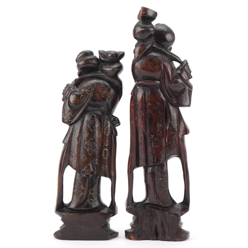 152 - Two Chinese carved softwood figures of elders, 20th century, with wire inlaid decoration, the larges... 