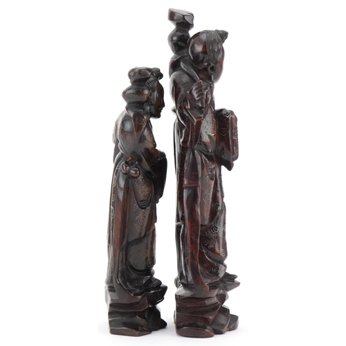 152 - Two Chinese carved softwood figures of elders, 20th century, with wire inlaid decoration, the larges... 