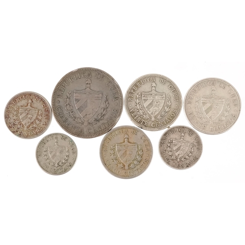 2129 - Seven early 20th century Cuban coins, five silver, the earliest date 1915, the largest denomination ... 