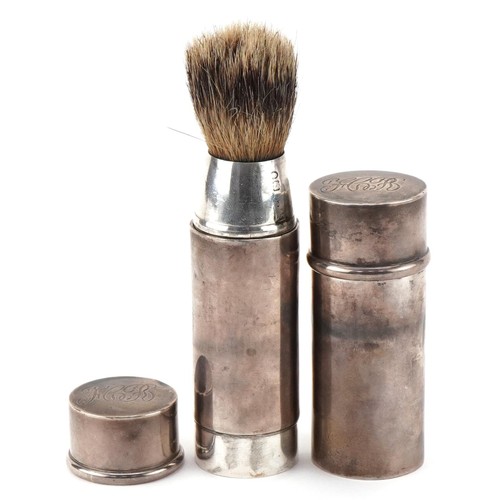 404 - A Barrett & Sons, George V silver travelling soap and shaving brush, London 1910, the largest 8cm hi... 