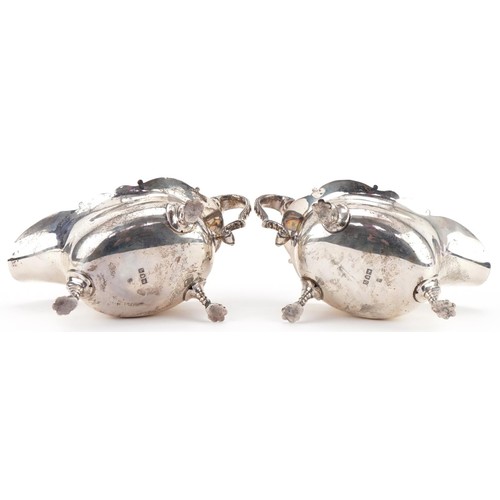 407 - C S Harris & Sons Ltd, pair of George V silver three footed sauce boats, London 1911, each 17.5cm in... 