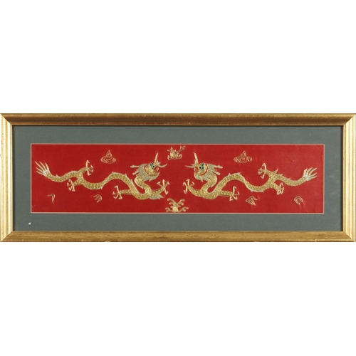 395 - Late 20th century Chinese embroidered panel decorated with two dragons in gold thread, framed and gl... 