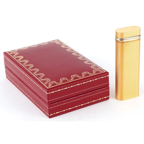 170 - Must de Cartier, gold plated engine turned pocket lighter with box and certificate, 7cm high