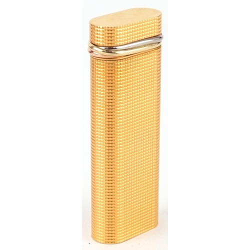 170 - Must de Cartier, gold plated engine turned pocket lighter with box and certificate, 7cm high