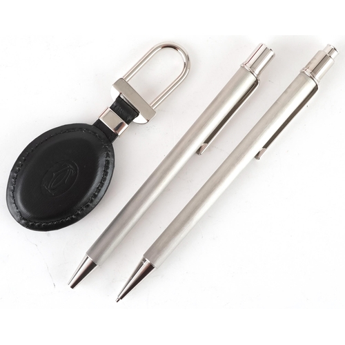 172 - Cartier, boxed set - ballpoint pen, propelling pencil and key chain