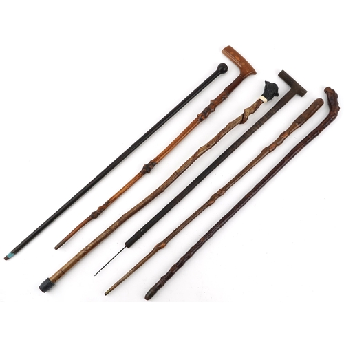 1422 - Six vintage and later wooden walking sticks including one carved with a pheasant head, the largest 9... 