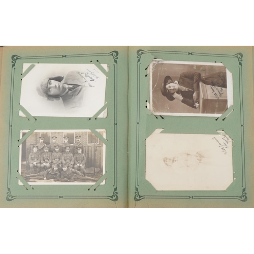 2437 - Early 20th century and later postcards and photographs arranged in an album, including Cairo, milita... 