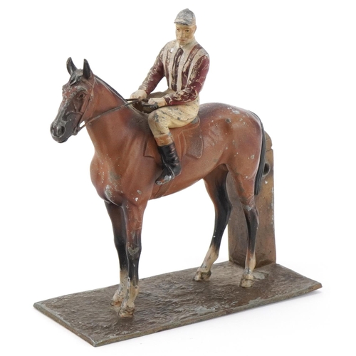 13 - Cold painted spelter jockey on horseback, 17cm in length