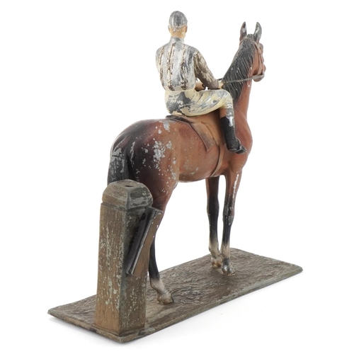 13 - Cold painted spelter jockey on horseback, 17cm in length