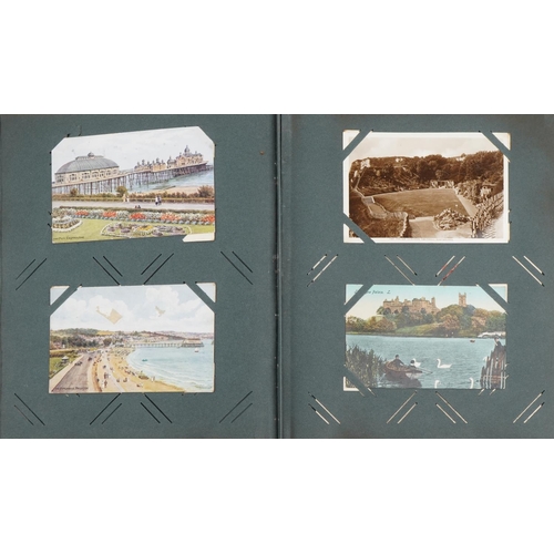 2438 - Early 20th century and later postcards and greetings cards arranged in two albums including Eastbour... 