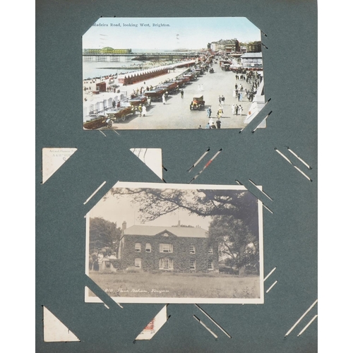 2438 - Early 20th century and later postcards and greetings cards arranged in two albums including Eastbour... 