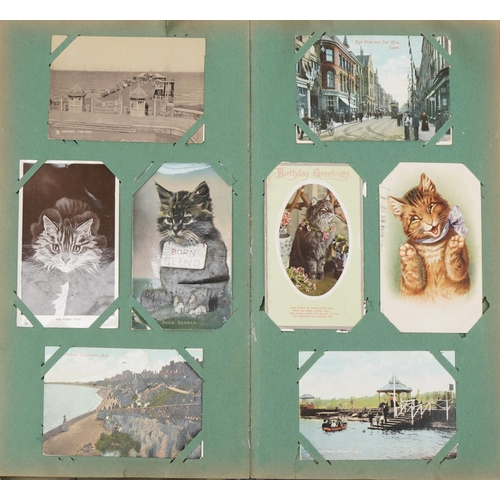 2438 - Early 20th century and later postcards and greetings cards arranged in two albums including Eastbour... 