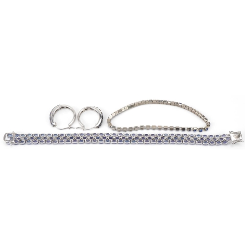 3230 - Modern silver and tanzanite bracelet, 20cm in length, together with a pair of silver and tanzanite h... 