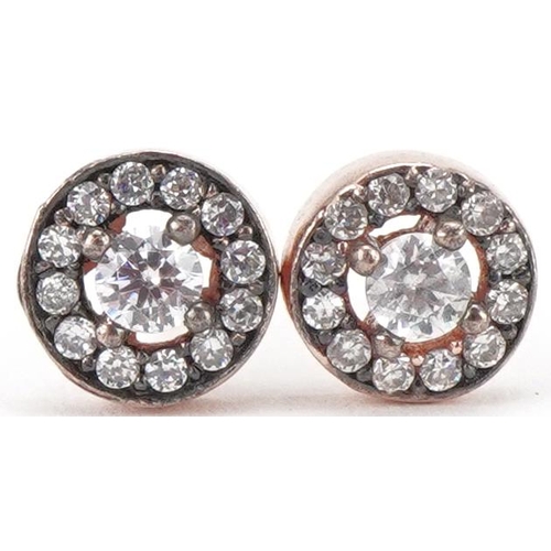 3015 - Pair of gold and diamond cluster earrings, the central diamond 3mm in diameter, 1.3g