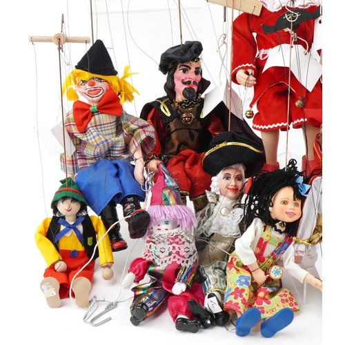 2043 - Collection of 20th century carved wood puppets, all with painted decoration, the largest 40cm high