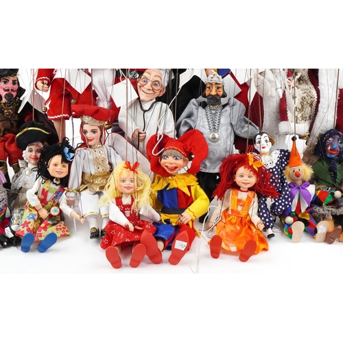 2043 - Collection of 20th century carved wood puppets, all with painted decoration, the largest 40cm high