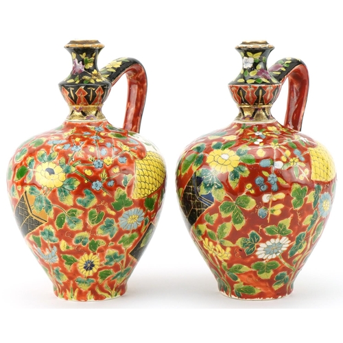 262 - Pair of late 19th century Austro Hungarian Fischer J. pottery ewers with hand painted floral decorat... 