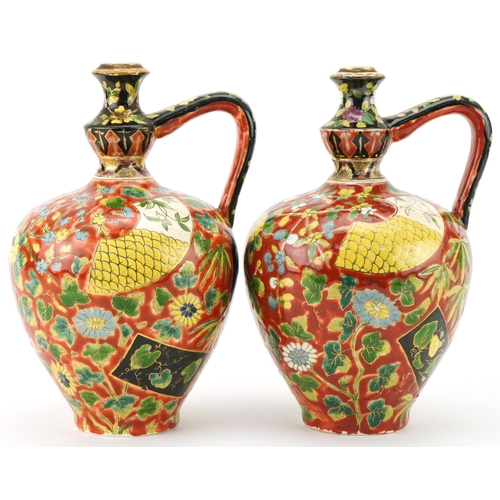 262 - Pair of late 19th century Austro Hungarian Fischer J. pottery ewers with hand painted floral decorat... 