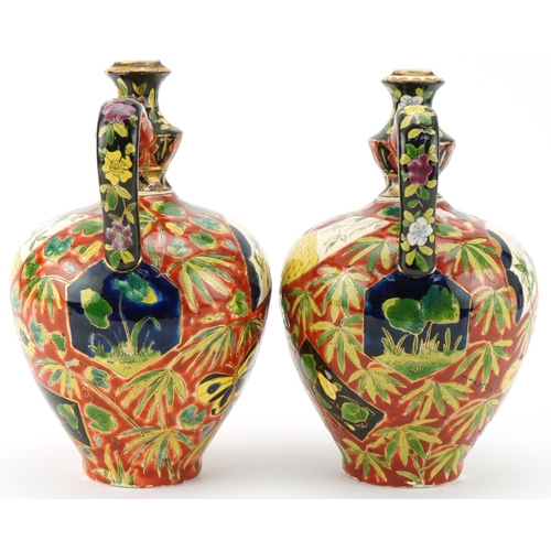 262 - Pair of late 19th century Austro Hungarian Fischer J. pottery ewers with hand painted floral decorat... 