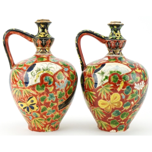  Pair of late 19th century Austro Hungarian Fischer J. pottery ewers with hand painted floral decorat... 