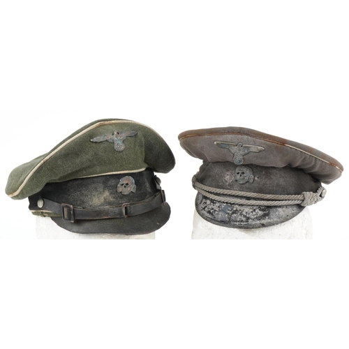 2645 - Two German military interest visor caps with badges