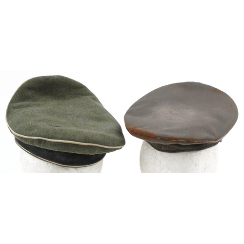 2645 - Two German military interest visor caps with badges