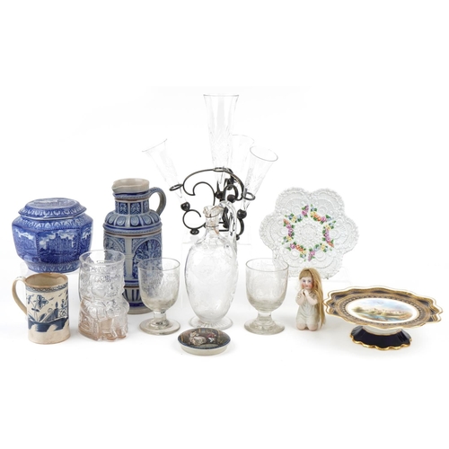 1135 - Mixed group of glassware and pottery items including ewers, jugs and a footed plate, the largest jug... 