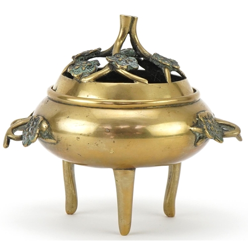 215 - Late 19th/20th century Chinese polished bronze tripod censer and cover, the pierced cover above oppo... 