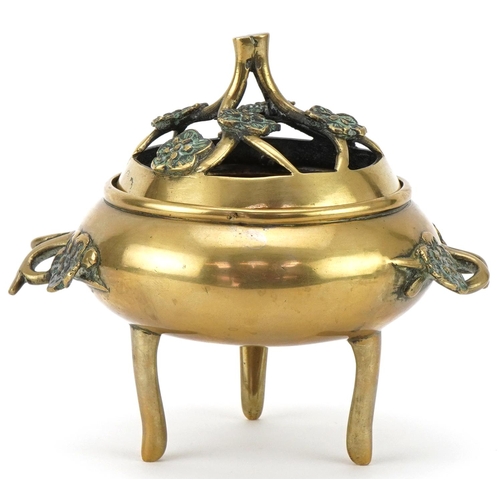 215 - Late 19th/20th century Chinese polished bronze tripod censer and cover, the pierced cover above oppo... 