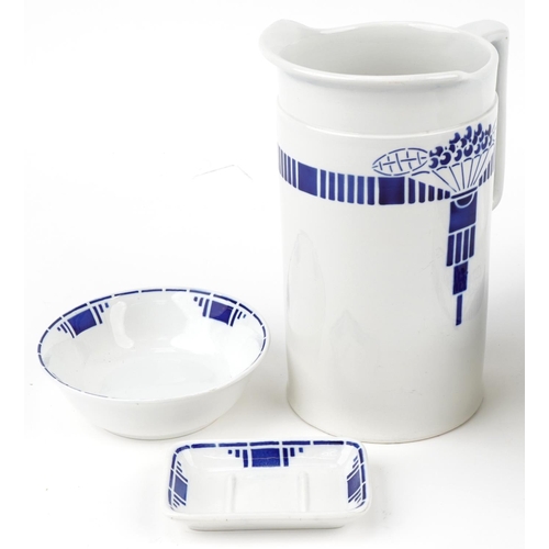 319 - French Art Deco four piece blue and white pottery wash set, the bowl 32cm in diameter