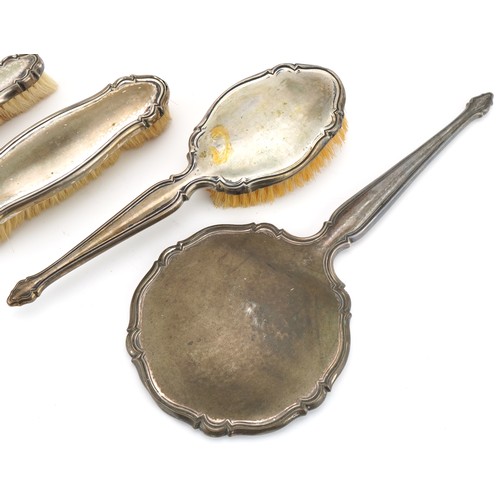 457 - Four German silver backed vanity items including hand mirror and clothes brush, the largest 32cm in ... 