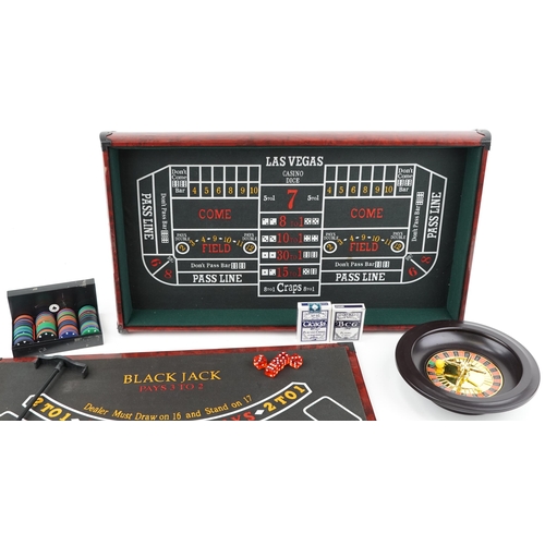 2042 - Casino games compendium including roulette and Black Jack, 73cm in length