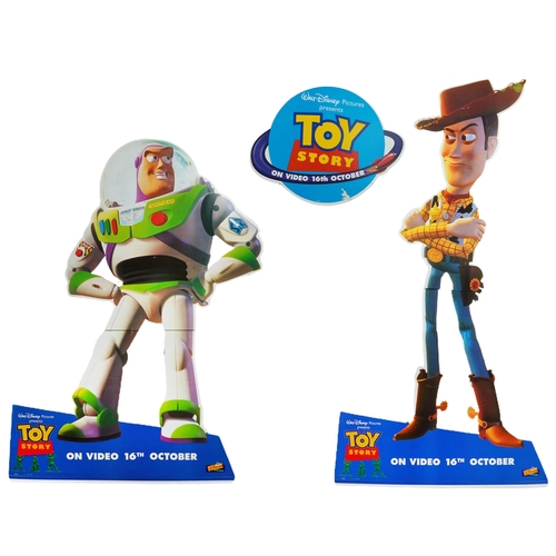 2469 - Three large Toy Story cardboard cut-out advertising boards of Woody and Buzz Lightyear and a hanging... 