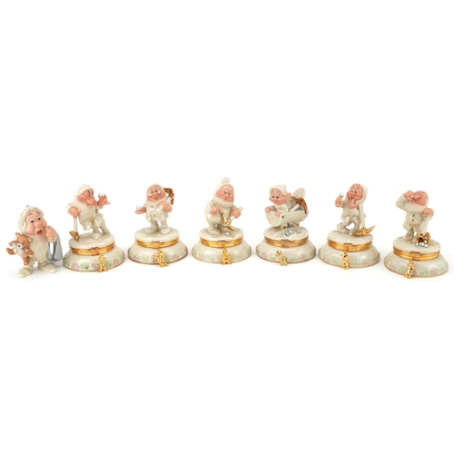 512 - Six Lenox porcelain Disney Dwarf trinkets and one other, the trinkets each housing a charm, 10cm hig... 