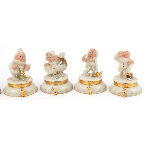 512 - Six Lenox porcelain Disney Dwarf trinkets and one other, the trinkets each housing a charm, 10cm hig... 