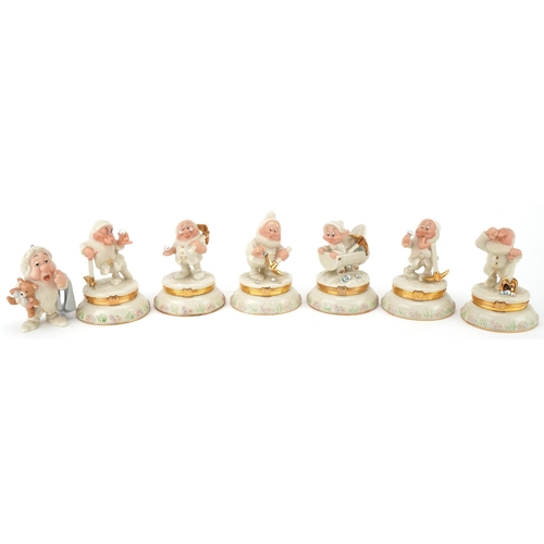 512 - Six Lenox porcelain Disney Dwarf trinkets and one other, the trinkets each housing a charm, 10cm hig... 