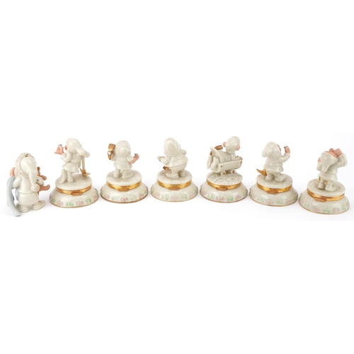 512 - Six Lenox porcelain Disney Dwarf trinkets and one other, the trinkets each housing a charm, 10cm hig... 