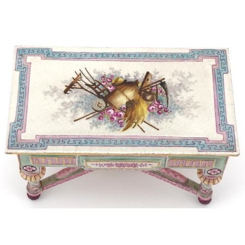 33 - 19th century French porcelain and painted doll's house centre table, the removable lid decorated wit... 