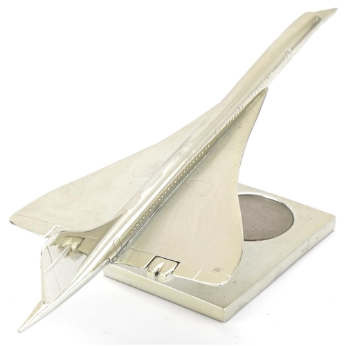 2412 - Royal Mint Concorde desk stand with inset five dollar coin together with a picture of Concorde, the ... 