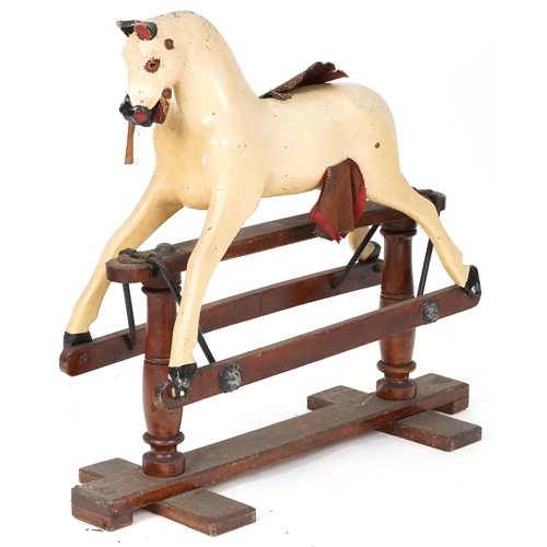 1051 - Antique wooden rocking horse, 83cm high x 87cm in length