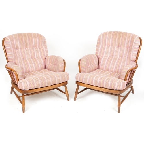 1005 - Pair of Ercol stained beech armchairs with loose cushion seats and backs raised on turned legs, 84cm... 