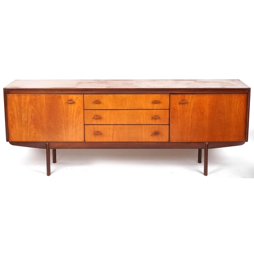 1023 - Mid 20th century teak sideboard manufactured by White & Newton Ltd, Portsmouth, fitted with three ce... 