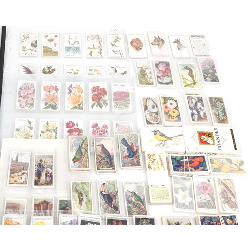 2304 - Collection of cigarette cards and tea cards, some arranged in albums, including a set of fifty John ... 